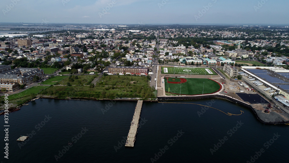 Fototapeta premium Aerial view of residential area along the Perth Amboy Waterfront including a football and baseball field
