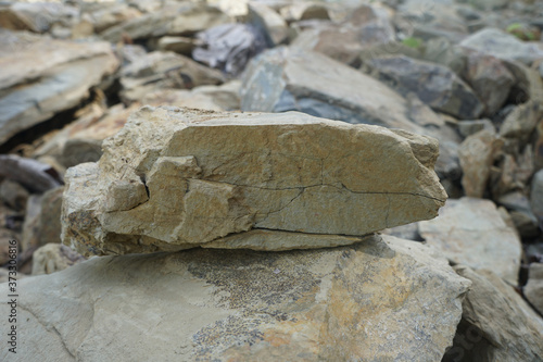 piece of shale rock on nature background. Shale is a fine-grained sedimentary rock.