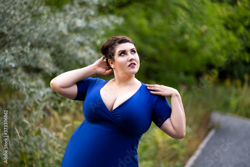 Plus Size Fashion Model in Blue Dress with a Deep Neckline Outdoors,  Beautiful Fat Woman with Big Breasts in Nature Stock Image - Image of  excess, female: 194296941