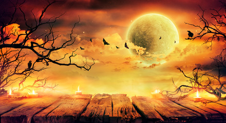 Halloween In Orange - Old Table With Candles And Branches At Scary Night With Full Moon
