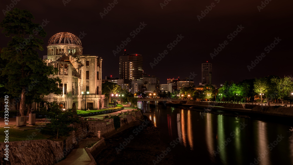 Peace Dome in Hiroshima Japan at night with skyline reflection