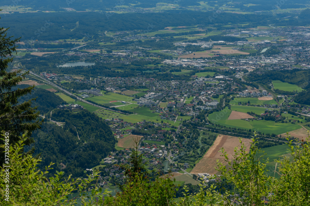 View from Kanzelhohe hill with cable cars and hotels in sunny fresh summer day