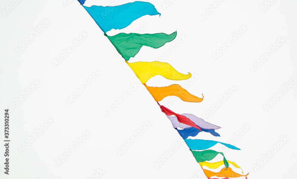 Fairground triangle flag hanging on a rope for a fun party Fiesta event,  carnival festival event, Park or street Festa decoration design isolated on  white background Stock Photo