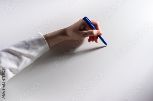 Human hand with a pen on a ...