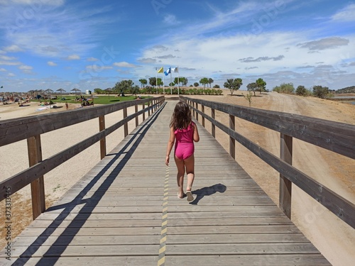 girl walking on the bridge