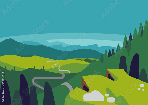 Mountain valley landscape with panoramic view from mountain top to the hills and long winding road