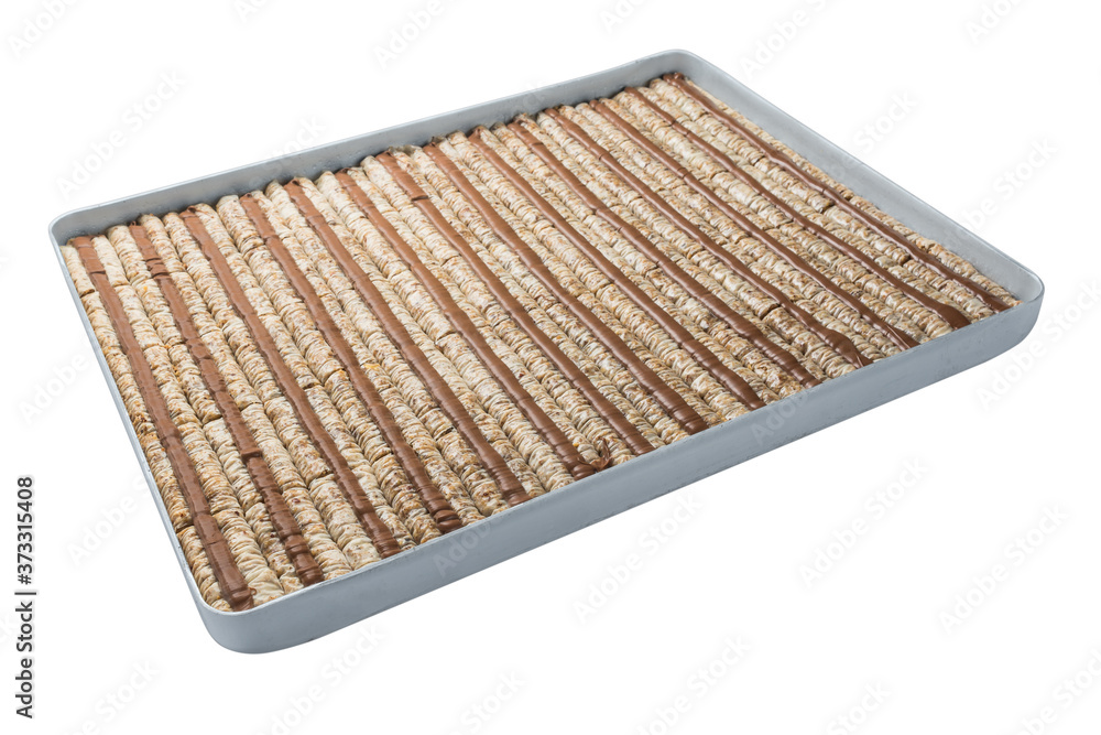 Turkish baklava, oriental sweets on a metal tray, isolated on white background. Horizontal format. Turkish baklava, oriental sweets on a metal tray, isolated on white background. Horizontal format.