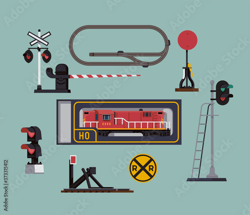 Scale model railway hobby items illustration in flat style featuring simplified model railroad layout, bumper buffer, signal lights, grade crossing gate, switch post and locomotive in original box