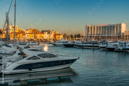 Vilamoura Marina, Portugal. Sunset from this exclusive place surrounded by boats and luxury hotels. photo