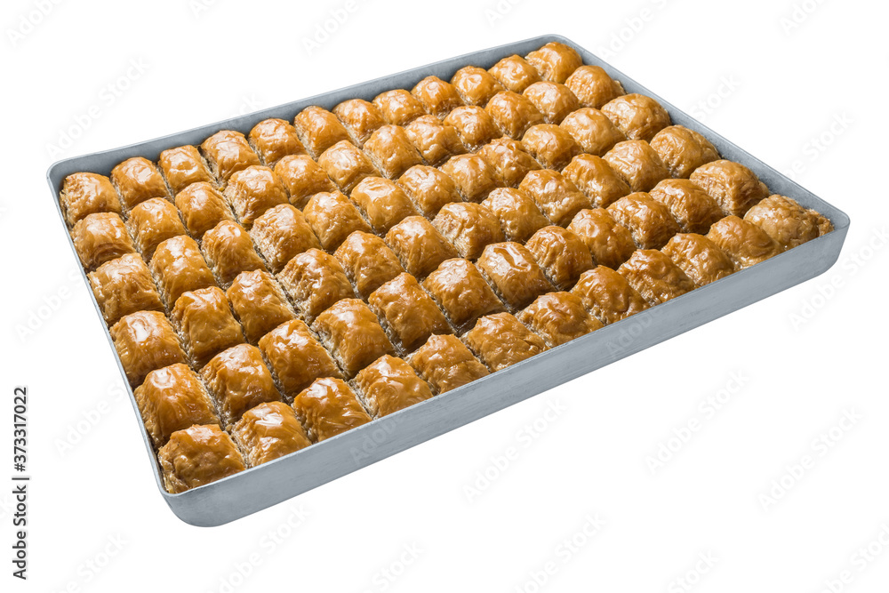 Turkish baklava, oriental sweets on a metal tray, isolated on white background. Horizontal format. Turkish baklava, oriental sweets on a metal tray, isolated on white background. Horizontal format.