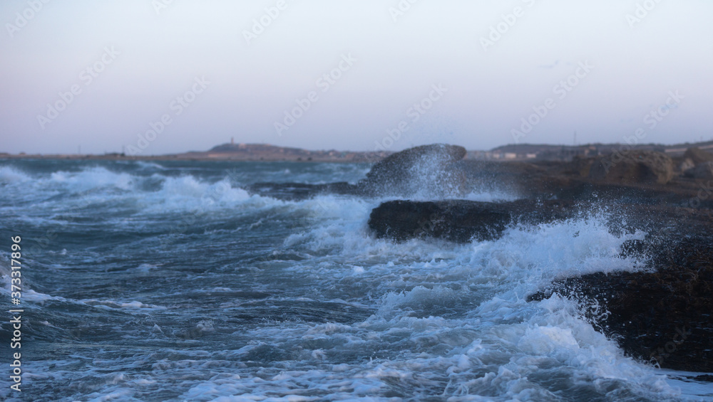 Waves crashing against rocks on Baku beach