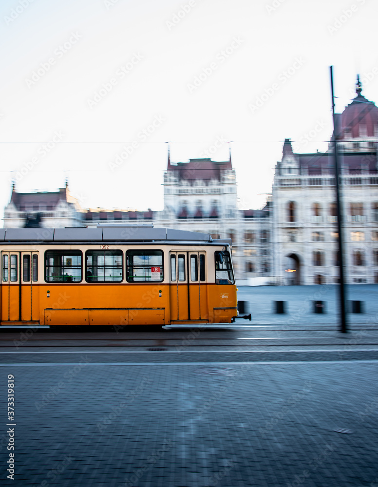 Yellow Tram in Motion in Budapest Hungary