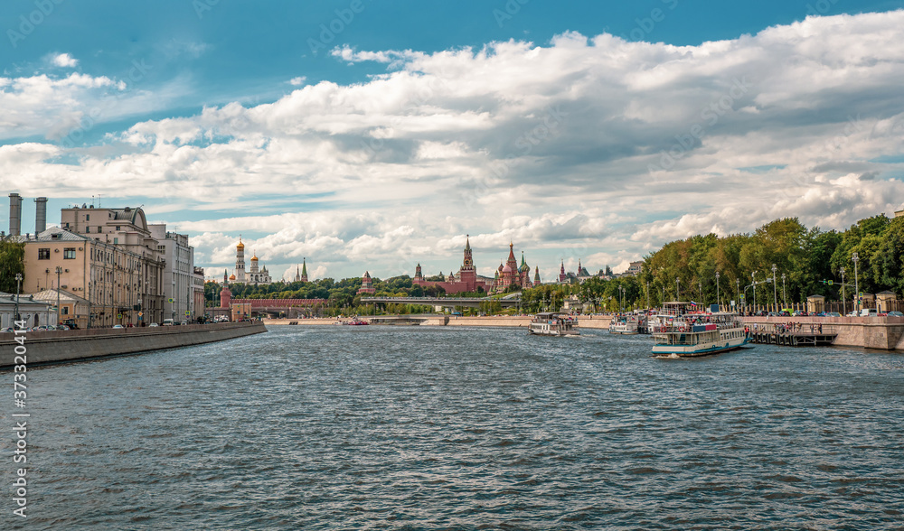 A tourist ship is moored to a pier on the Moscow river.