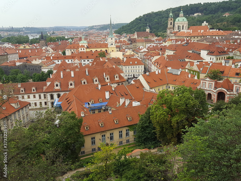 Fototapeta premium A bird's eye view of the brown and crowded roofs of Prague houses