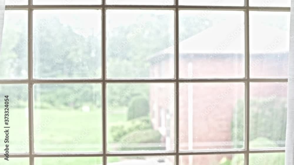 Sheer window curtains open with shallow depth of field. Sheer window curtains open with shallow depth of field.