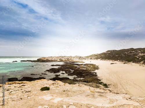 Blue cloudy sky and yellow sand on the coast in De Hoop Nature Reserve in South Africa