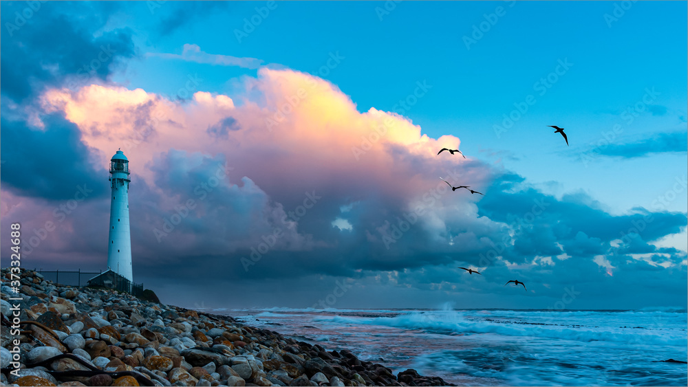 Fototapeta premium Slangkop Lighthouse, Kommetjie, Cape Town, South Africa at sunset