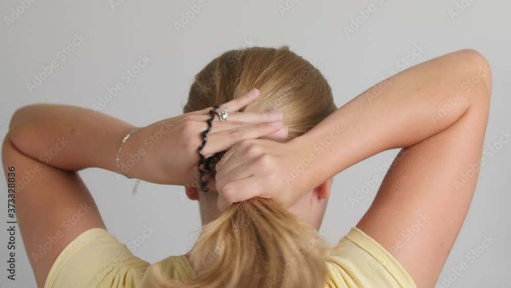 Attractive young blond caucasian woman wears black hair ribbon 4k 50fps Attractive young blond caucasian woman wears black hair ribbon 4k 50fps
