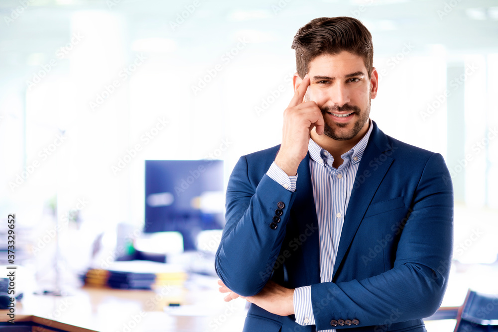 Businessman portrait while standing in the office Businessman portrait while standing in the office