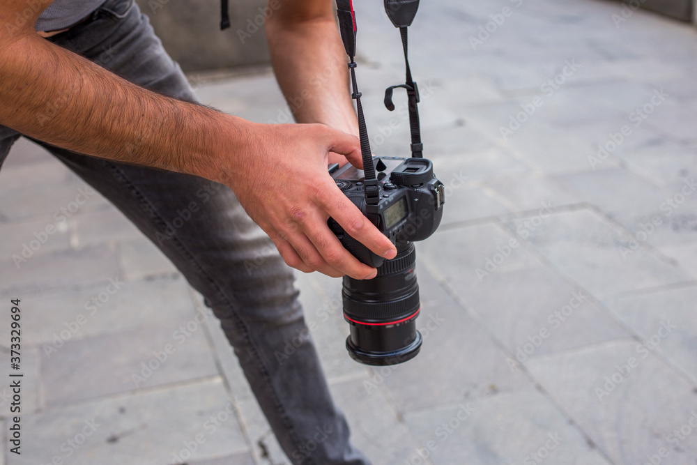 man is holding an  photocamera