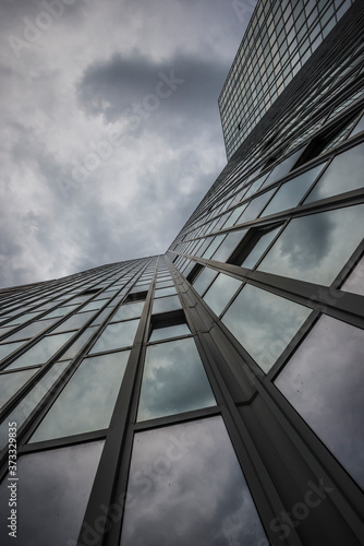 Wallpaper Mural modern office building with storm clouds Torontodigital.ca