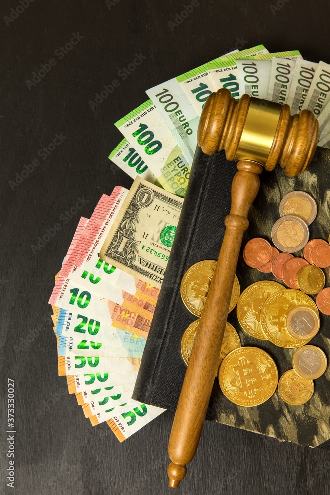 Money and judges hammer on wooden table. Representation of corruption and bribery in the judiciary. Bribery of judges.
