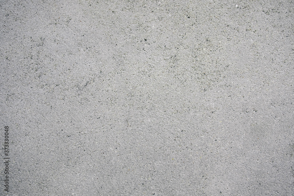 Gray concrete floor with a beautiful texture. Surface for inscriptions or text. Gray concrete floor with a beautiful texture. Surface for inscriptions or text.