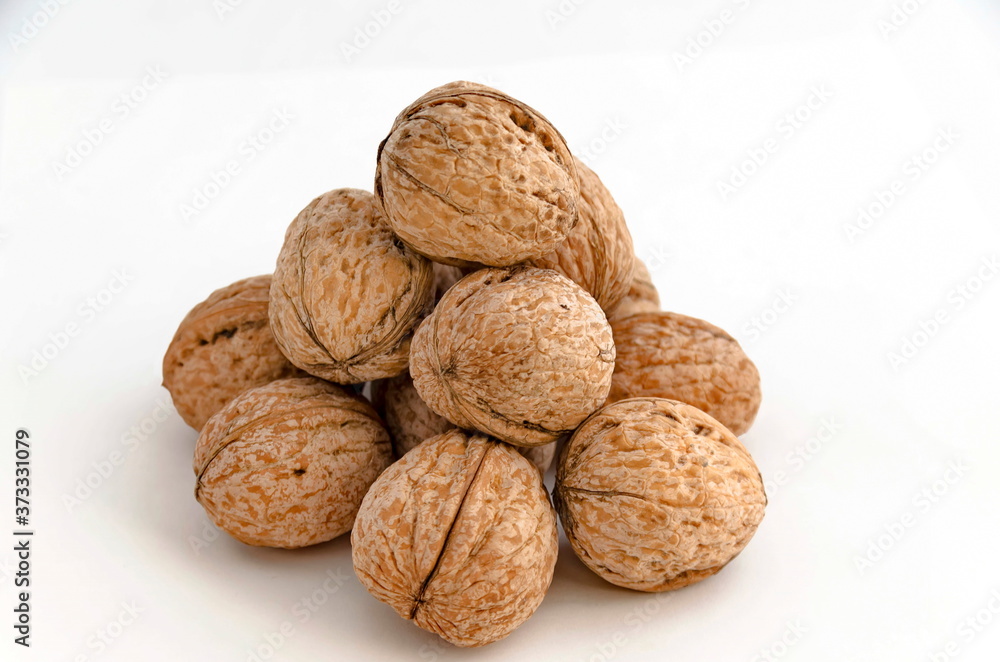 A photo of a group of ripe walnuts can be used as a background, Sofia, Bulgaria A photo of a group of ripe walnuts can be used as a background, Sofia, Bulgaria