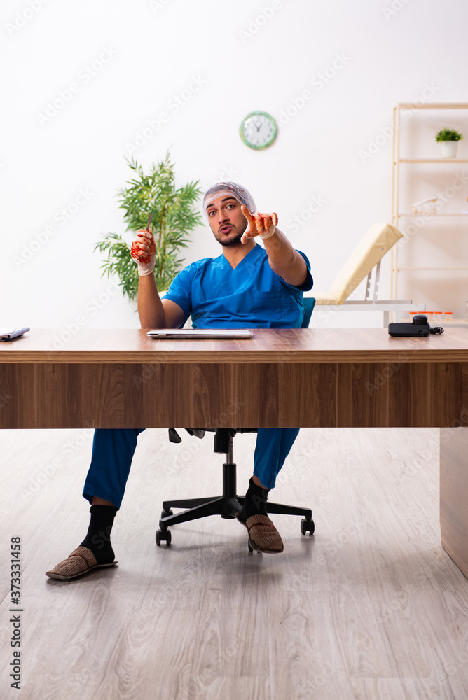 Young male doctor surgeon in fatal negligence concept Young male doctor surgeon in fatal negligence concept