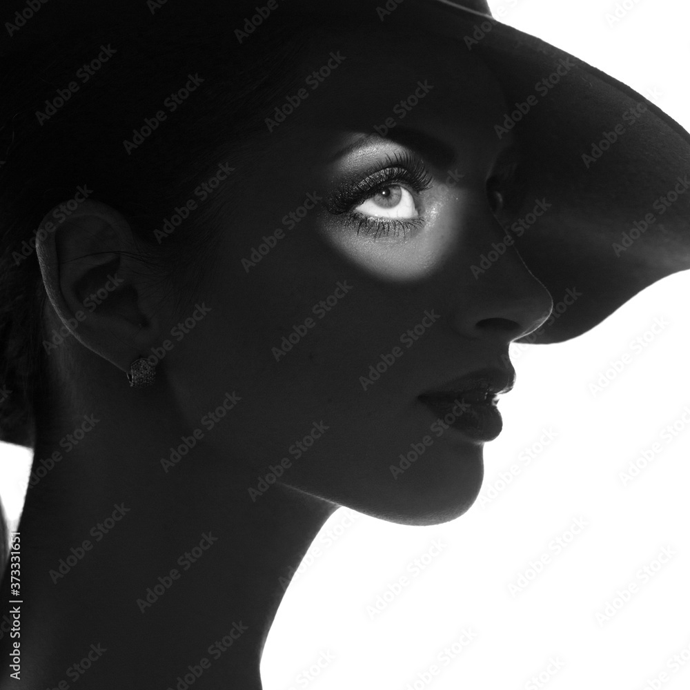 Black And White Mysterious Silhouette Portrait Of Elegant Girl In Hat Black and white mysterious silhouette portrait of elegant girl in hat
