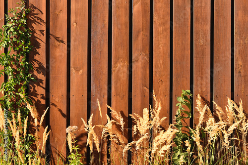 Foto Fence made of flat wooden planks