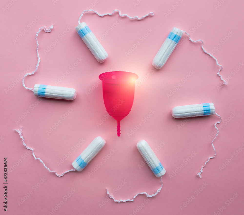 Menstrual cup and tampons. Reusable menstrual cup is an alternative to disposable tampons. Menstrual cup and tampons. Reusable menstrual cup is an alternative to disposable tampons.