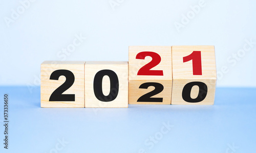 Wooden cubes with the inscription 2020-2021. Business concept.