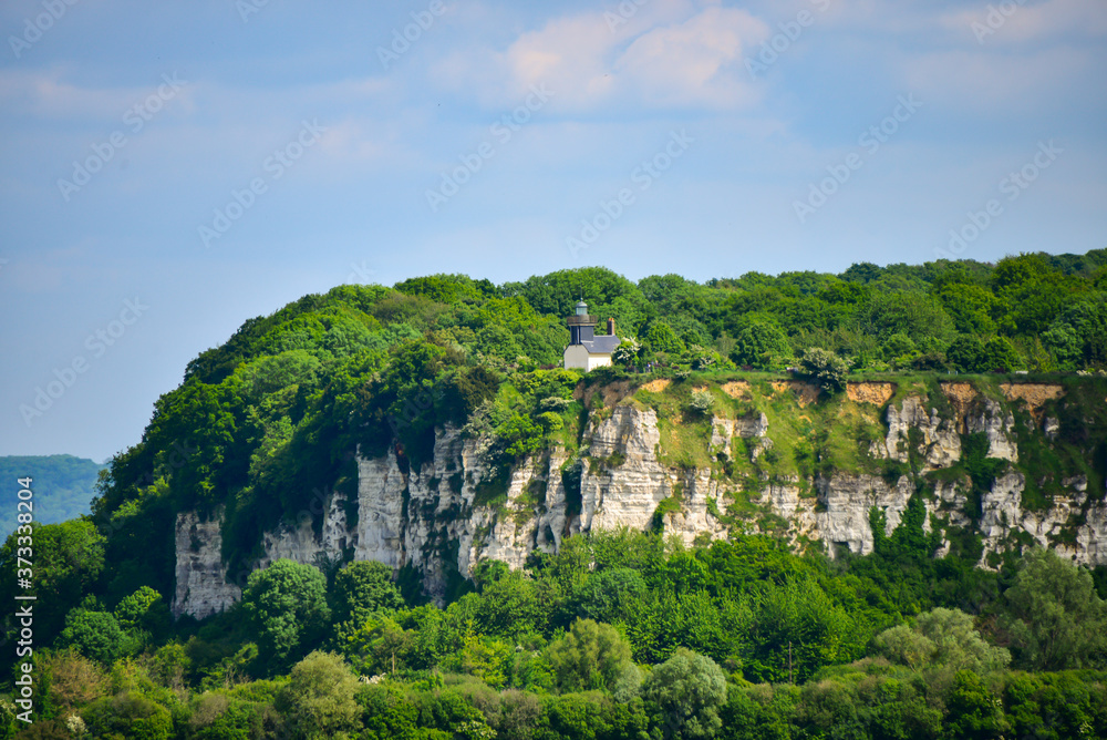 Beautiful green mountain on the coast of Seine river in France