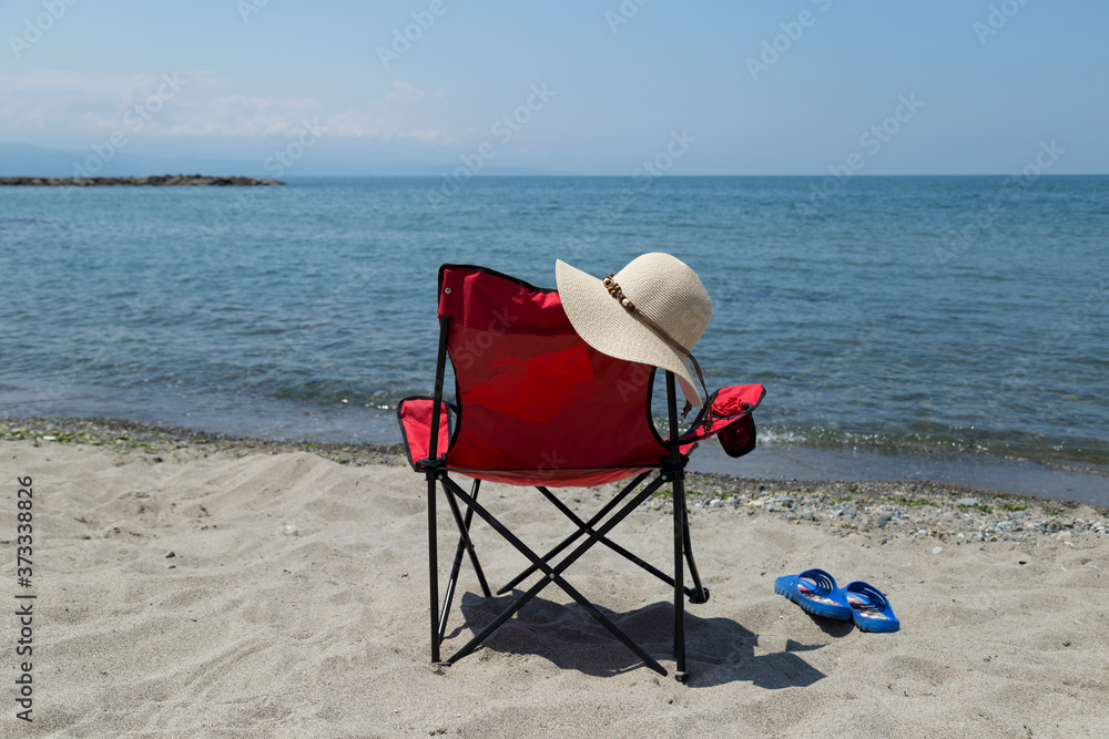 Red camp comfortable chair near the seaside. A beautiful sea view from Black sea Turkey. Red camp comfortable chair near the seaside. A beautiful sea view from Black sea Turkey.