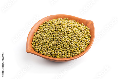 lay bowl with raw green mung bean isolated on white background. Side view.