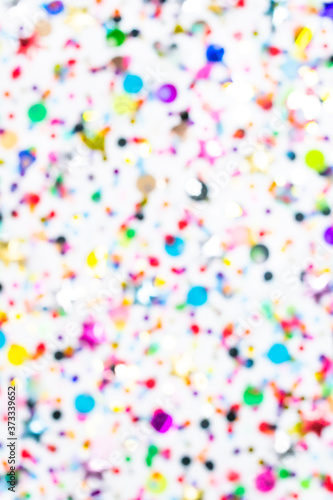 Colorful confetti defocused blur wallpaper. Party pattern, white background. luxury festive holiday. Creative glitter decoration. congratulations, new year, birthday, wedding, christmas flat lay