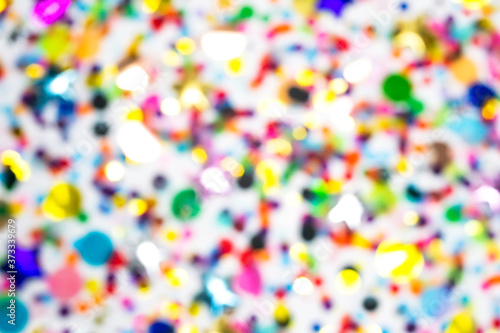 Colorful confetti defocused blur wallpaper. Party pattern, white background. luxury festive holiday. Creative glitter decoration. congratulations, new year, birthday, wedding, christmas flat lay