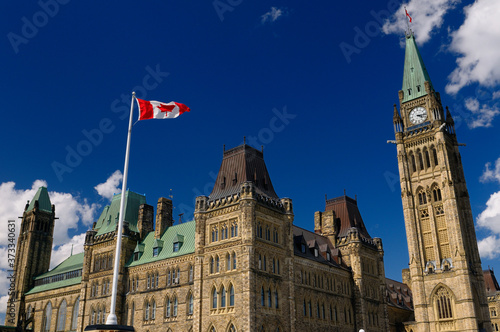 Ottawa Parliament Buildings Center Block with Peace Tower and Canadian flag photo