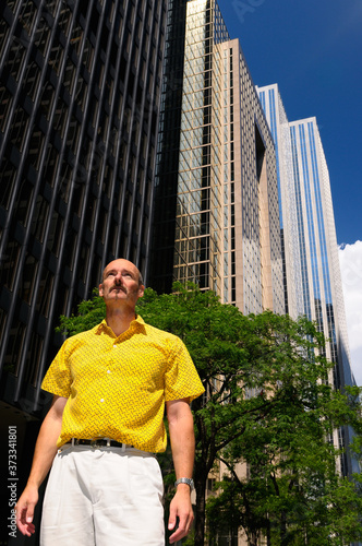 Photography Man looking up at skyscrapers in financial district of Toronto