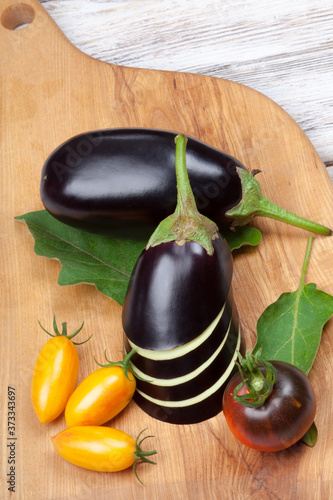 Perfect eggplants and tomatoes  on white background