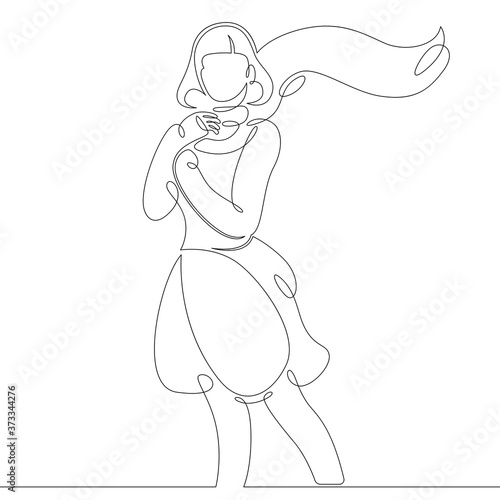 portrait of beautiful woman with developing long shawl scarf