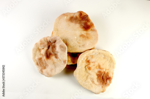 a pile of pita breads on a white background