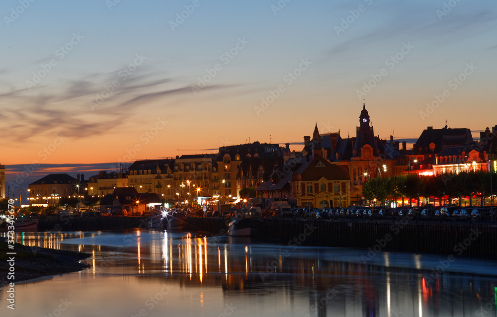 Landscape view on the riverside of Trouville city at night , famous french resort in Normandy.