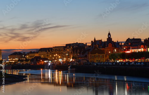 Landscape view on the riverside of Trouville city at night , famous french resort in Normandy.