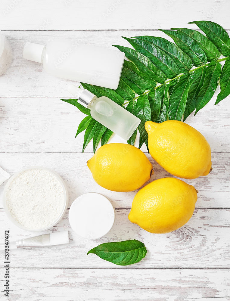 Natural organic homemade cosmetics with lemon. Skin care. Spa salon and treatments. Beautician background. Clay, lemon, beauty products.Tropical summer concept. Flat lay, copy space