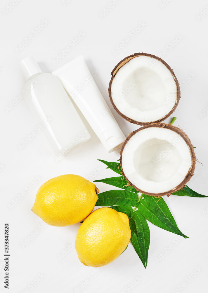 Natural organic homemade cosmetics with lemon and coconut. Skin care. Spa salon and treatments. Beautician background. Clay, lemon, beauty products.Tropical summer concept. Flat lay, copy space Natural organic homemade cosmetics with lemon and coconut. Skin care. Spa salon and treatments. Beautician background. Clay, lemon, beauty products.Tropical summer concept. Flat lay, copy space