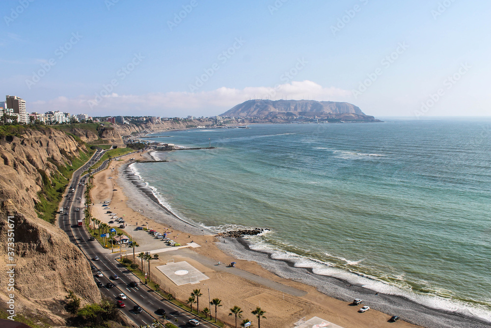 Green Coast in Lima Peru. Horizon, sea and sun.