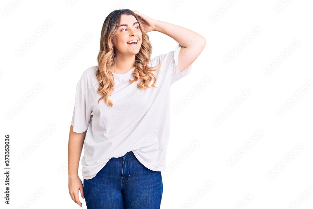 Fototapeta premium Young caucasian woman wearing casual clothes smiling confident touching hair with hand up gesture, posing attractive and fashionable