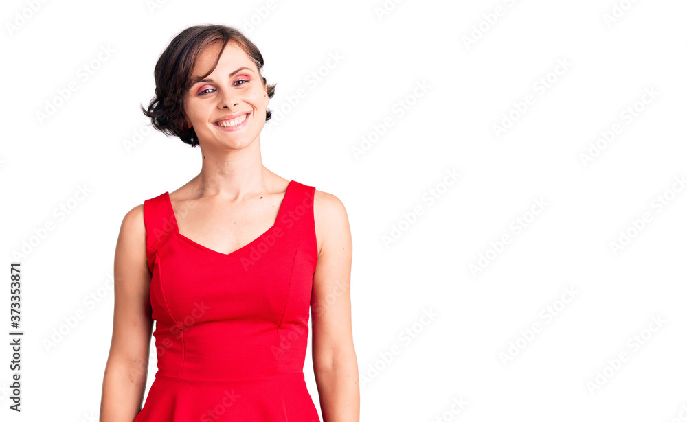 Beautiful young woman with short hair wearing casual style with sleeveless shirt with a happy and cool smile on face. lucky person. Beautiful young woman with short hair wearing casual style with sleeveless shirt with a happy and cool smile on face. lucky person.